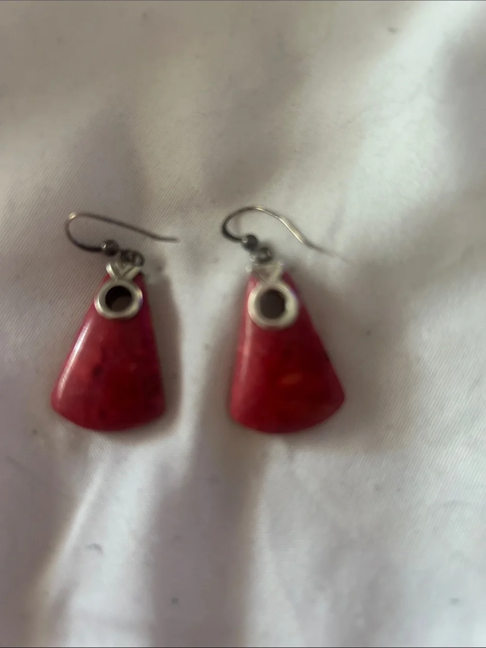 Nice silver and coral earrings. These match necklace with similar shape